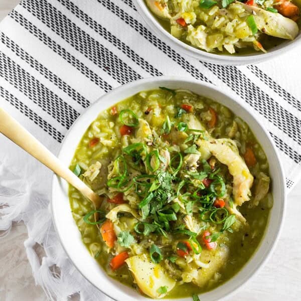 This Peruvian chicken soup (aka: aguadito de pollo) is a delicious winter soup full of rotisserieย chicken, rice, vegetables, and LOTS of cilantro. Super simple to make and ready in just an hour. It's the perfect weekday or weekend soup!ย