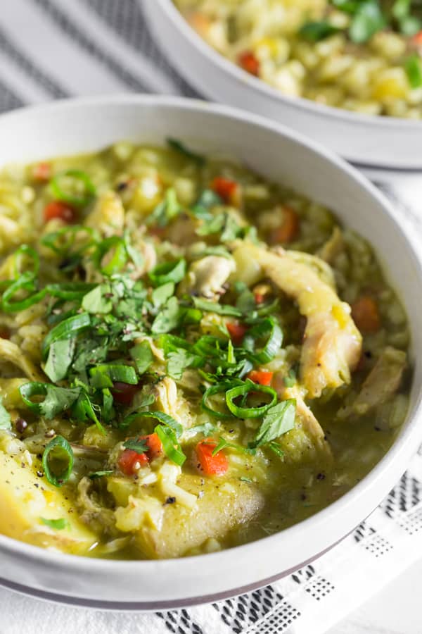 Peruvian Chicken Soup topped with cilantro and green onions.