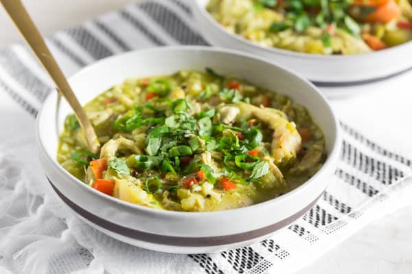 Peruvian Chicken Soup served with a spoon.