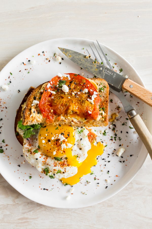 Shakshuka Hummus Toast on a plate.