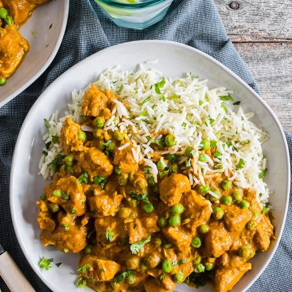 This Instant Pot Chicken Tikka Masala is a flavorful addition to your weekly menu. It's packed with tender chicken swimming in a thick and spice filled tomato coconut milk based sauce with peas served over basmati rice. Super simple to make and packed full of flavor! 