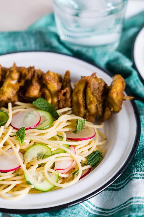 Chicken Satay Noodles served on a white plate. 