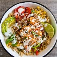 These chipotle shrimp fajita bowls are a quick weeknight dinner option that will make the whole family happy. It's full of flavorful chipotle lime shrimp that are served over rice with sauteed vegetables and drizzled with a cilantro lime Greek yogurt sauce. It's super simple and can be made in just 30 minutes!