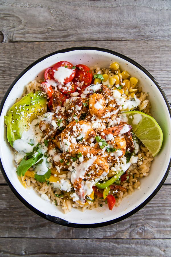 Chipotle Shrimp Fajita Bowls served with a cilantro lime yogurt sauce. 