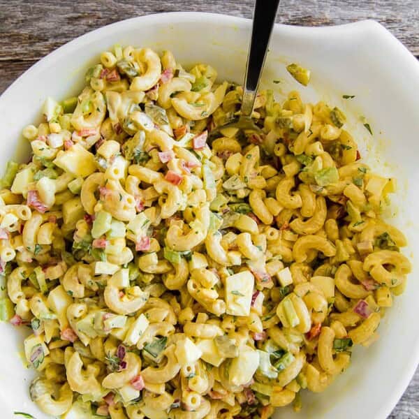 This classic macaroni salad is packed full of crunchy vegetables, hard-boiled eggs, and a homemade dressing made out of yellow mustard, mayonnaise, and pickle juice. It's the perfect old fashioned Easter side dish or a delicious summertime cookout addition.