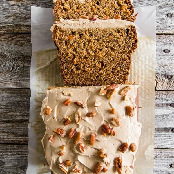 This carrot cake banana bread is topped with a creamy maple cream cheese frosting and the perfect use for ripe bananas. It's a flavorful twist to a classic quick bread that you're sure to love.