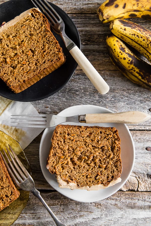 This carrot cake banana bread is topped with a creamy maple cream cheese frosting and the perfect use for ripe bananas. It's a flavorful twist to a classic quick bread that you're sure to love.