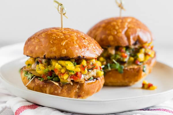 Chipotle Chicken Burgers Topped with Mango Salsa on a bun. 