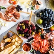 Ultimate Italian Antipasto Platter laid out on a white marble board