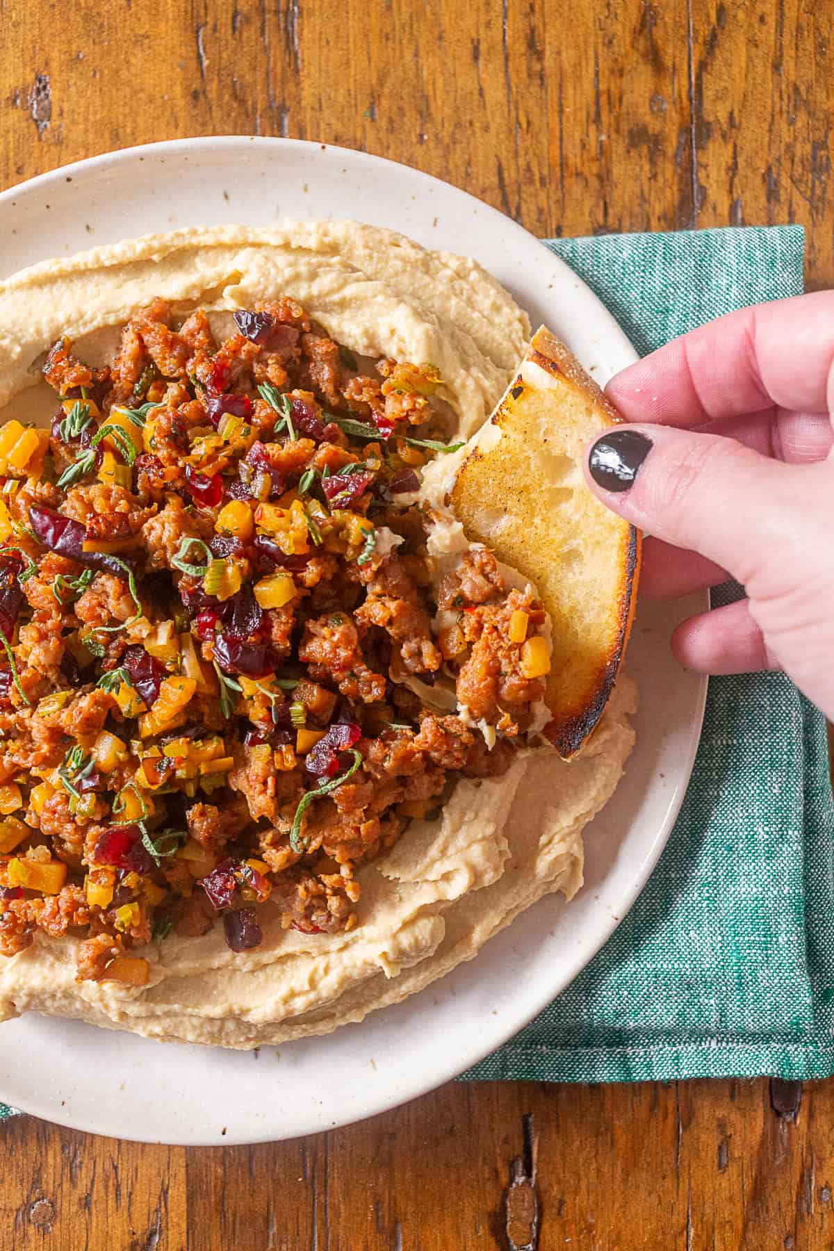 thanksgiving stuffing topped hummus with crusty bread