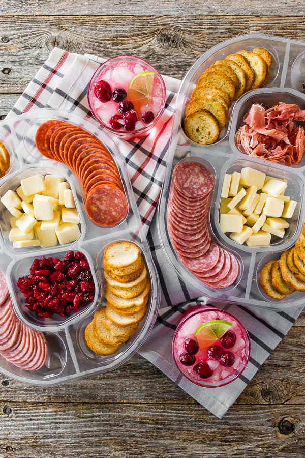 cranberry lemonade ginger beer cocktail served with meat and cheese party platters