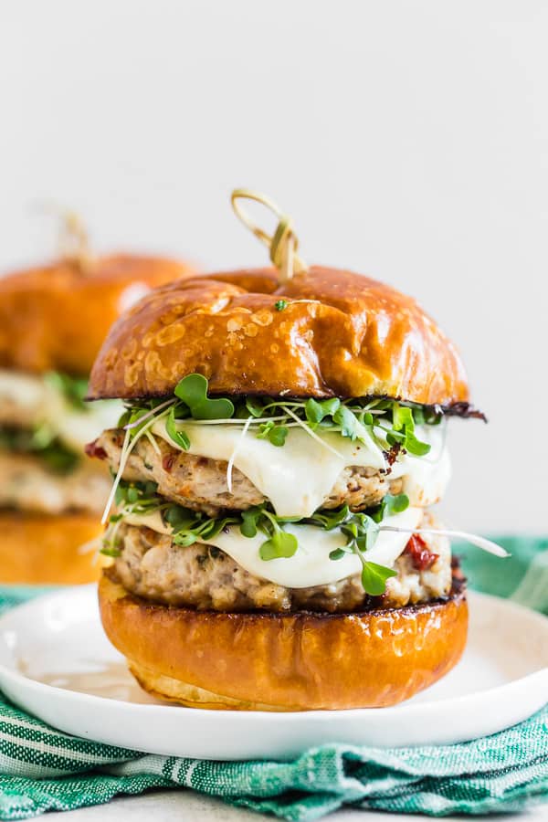 sun dried tomato chicken burgers on a plate