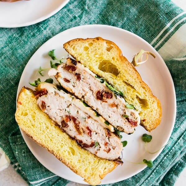 sun dried tomato chicken burgers cut in half