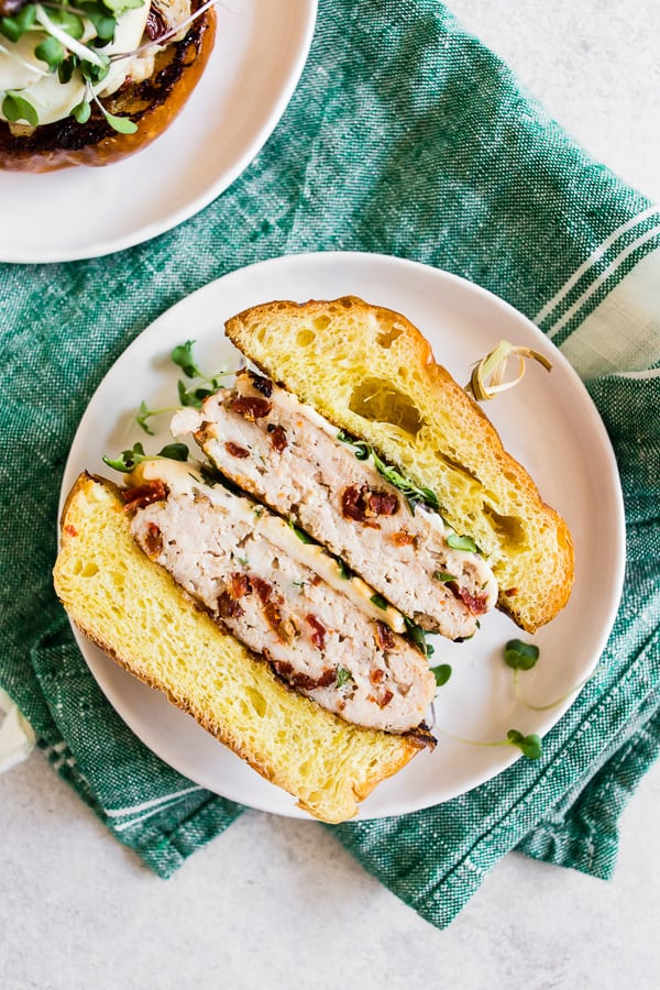 sun dried tomato chicken burgers cut in half