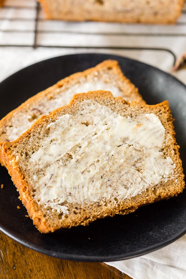 sliced sourdough discard banana bread with butter