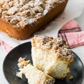 sourdough discard cinnamon crumb cake sliced on a plate with a fork