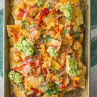 sweet chili chicken nachos on a small sheetpan