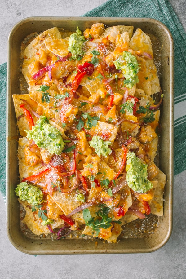 Thai sweet chili chicken nachos on a small sheetpan.