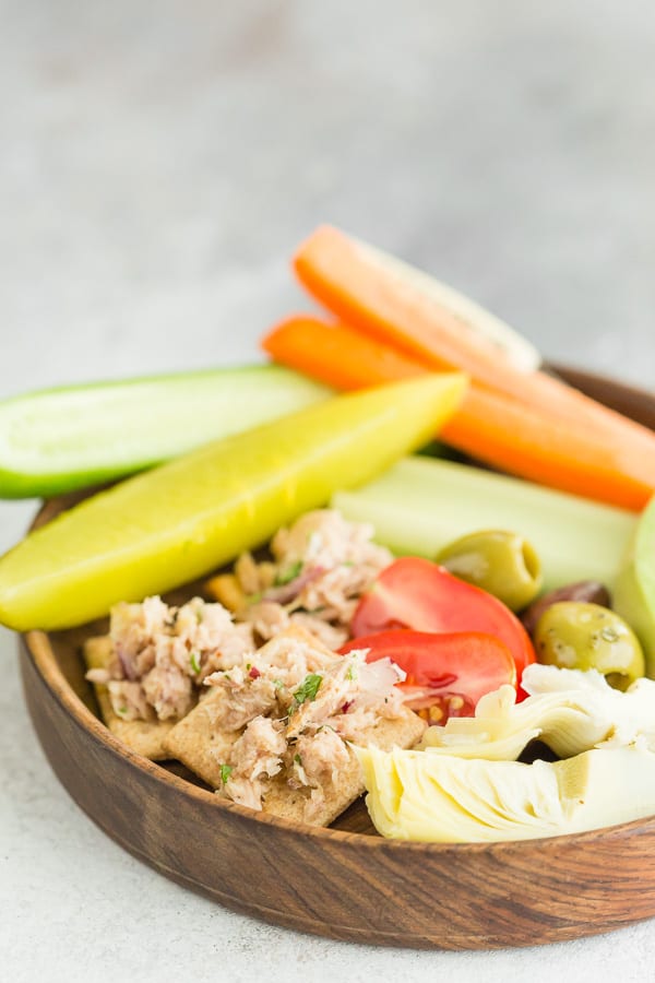 lemon herb tuna salad on crackers on a plate