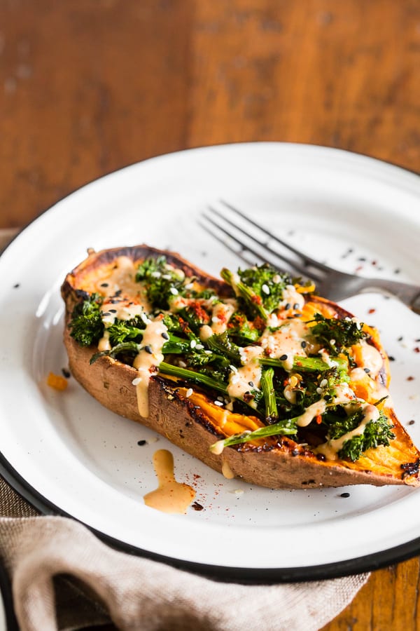 broccoli rabe and hummus stuffed sweet potatoes on a plate