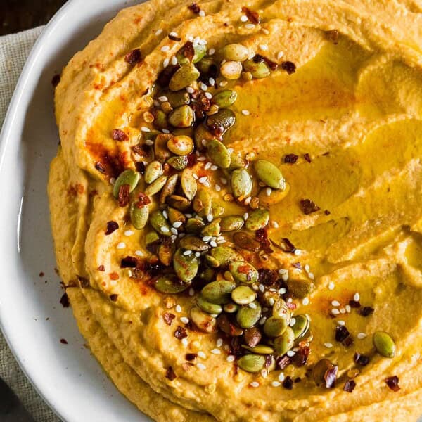 close up of toppings of pumpkin hummus