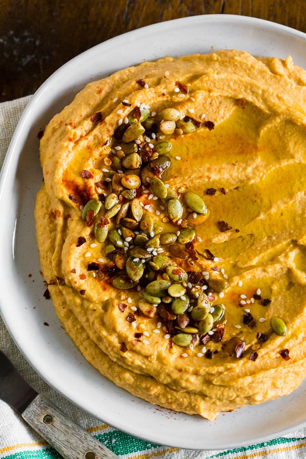 close up of toppings of pumpkin hummus.