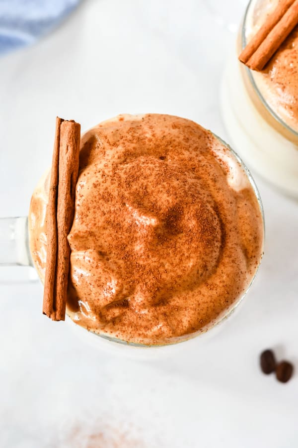 pumpkin spice whipped coffee garnished with spice in a cup