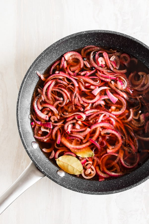 Overhead shot of quick and easy pickled red onions in a pan 