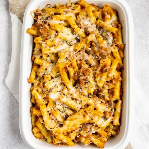 creamy pumpkin baked ziti in a white dish
