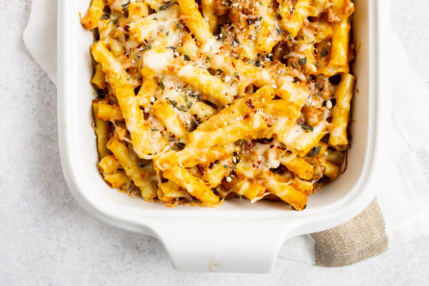 creamy pumpkin baked ziti on a white background