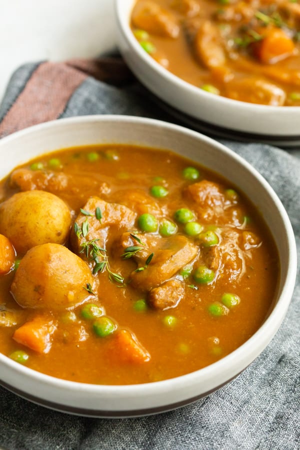 instant pot pumpkin beef stew in white ceramic bowls