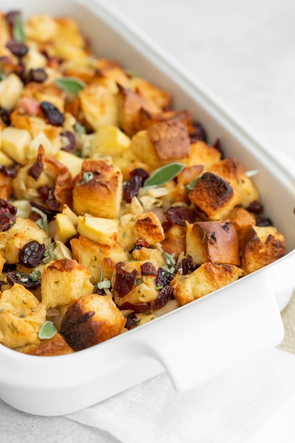 pancetta apple fennel brioche stuffing in a small white dish