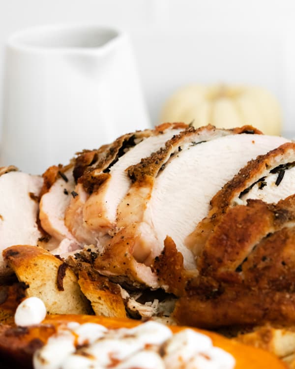 sheet pan thanksgiving dinner close up of the sliced turkey