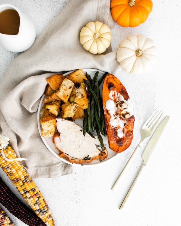 sheet pan thanksgiving dinner plated with fall decor