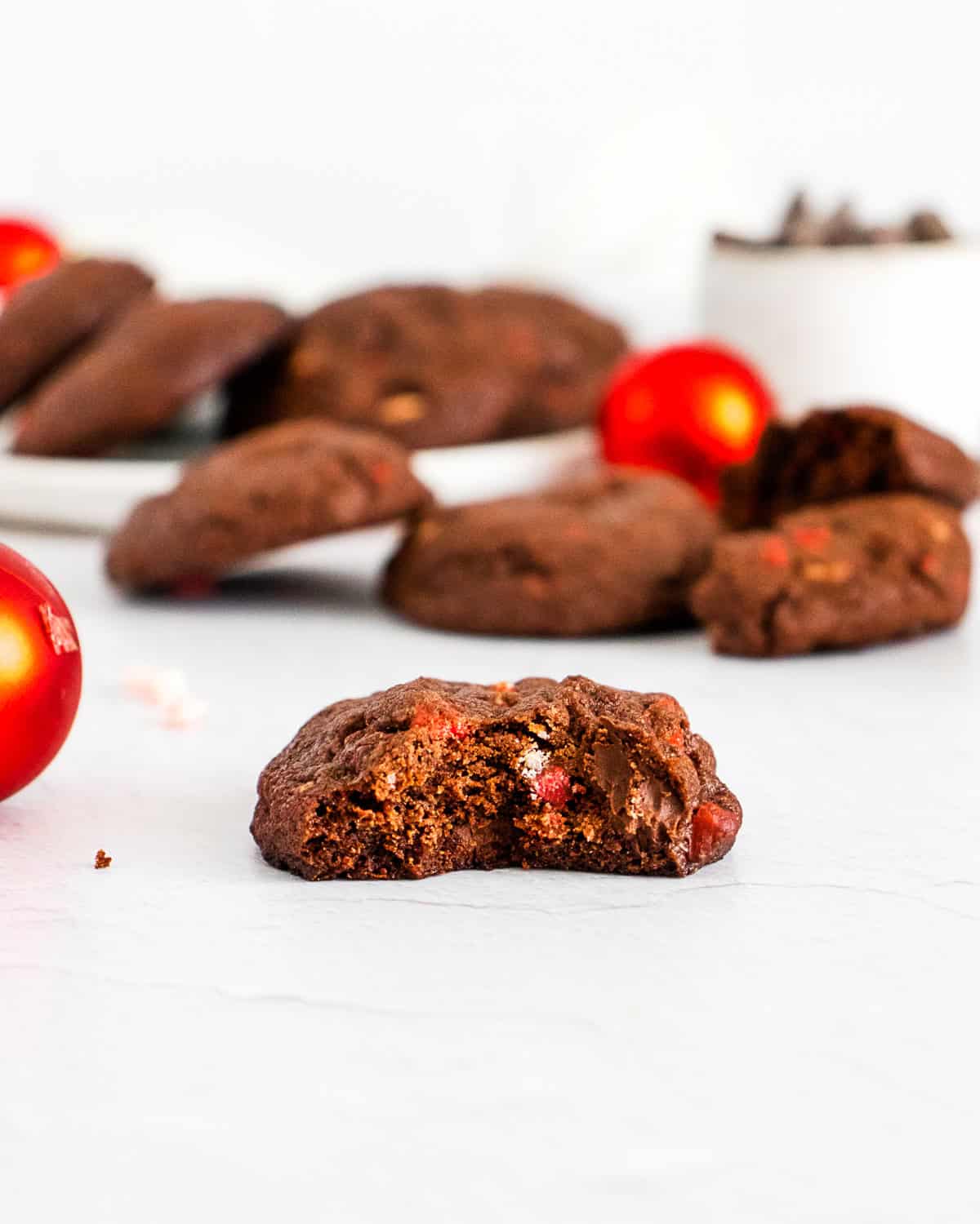 chocolate peppermint bark cookie with a bite taken out of it