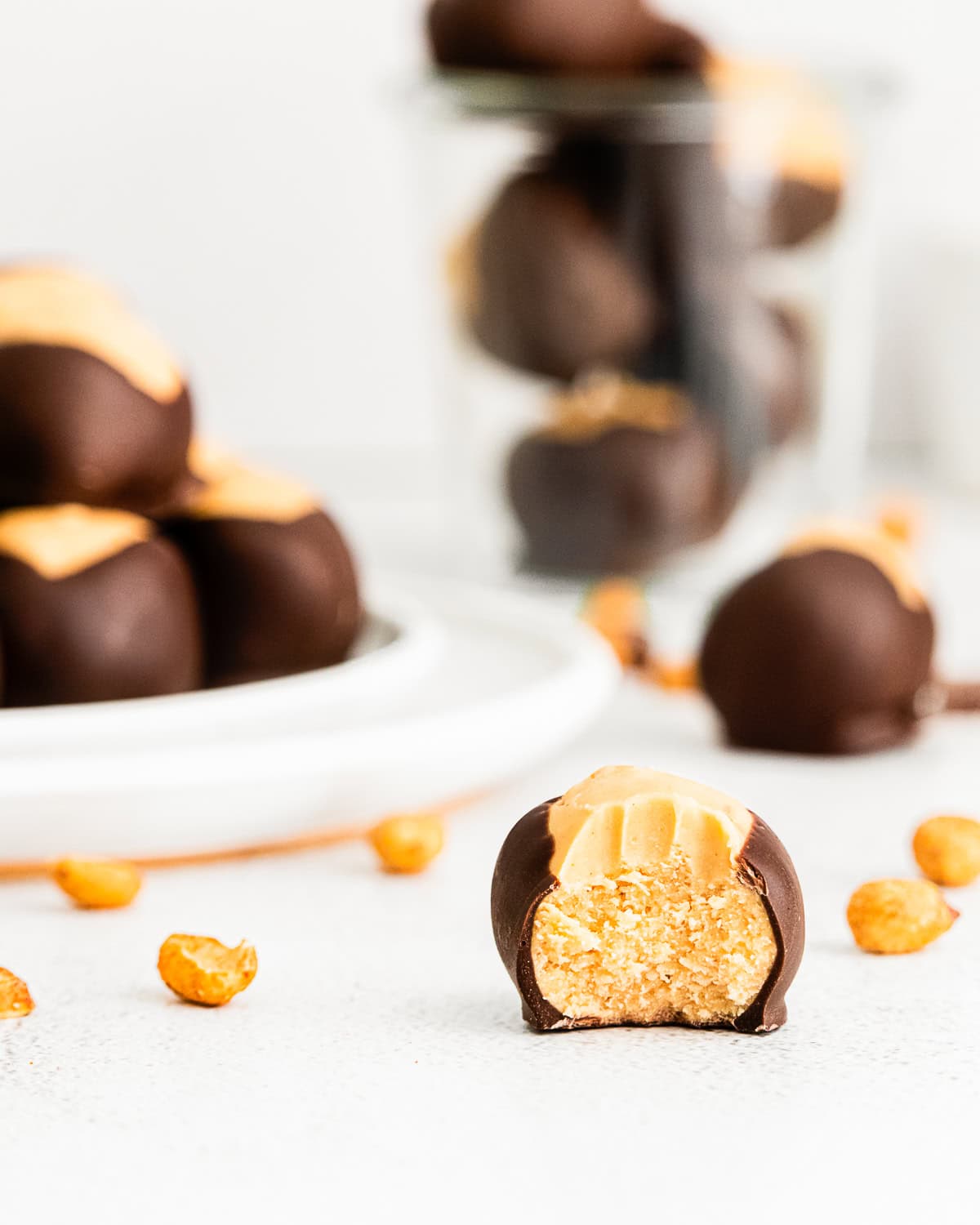 peanut butter buckeye with a bite out of it on a plate