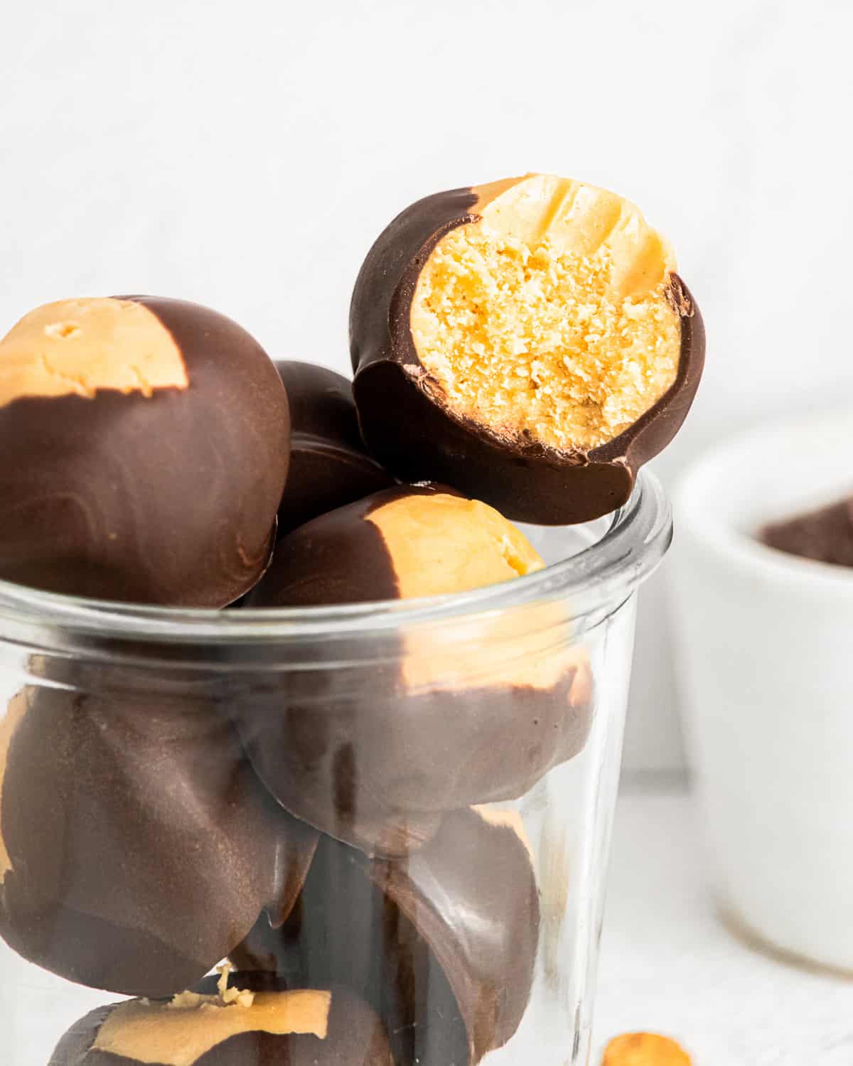 peanut butter buckeyes with a bite taken out of them