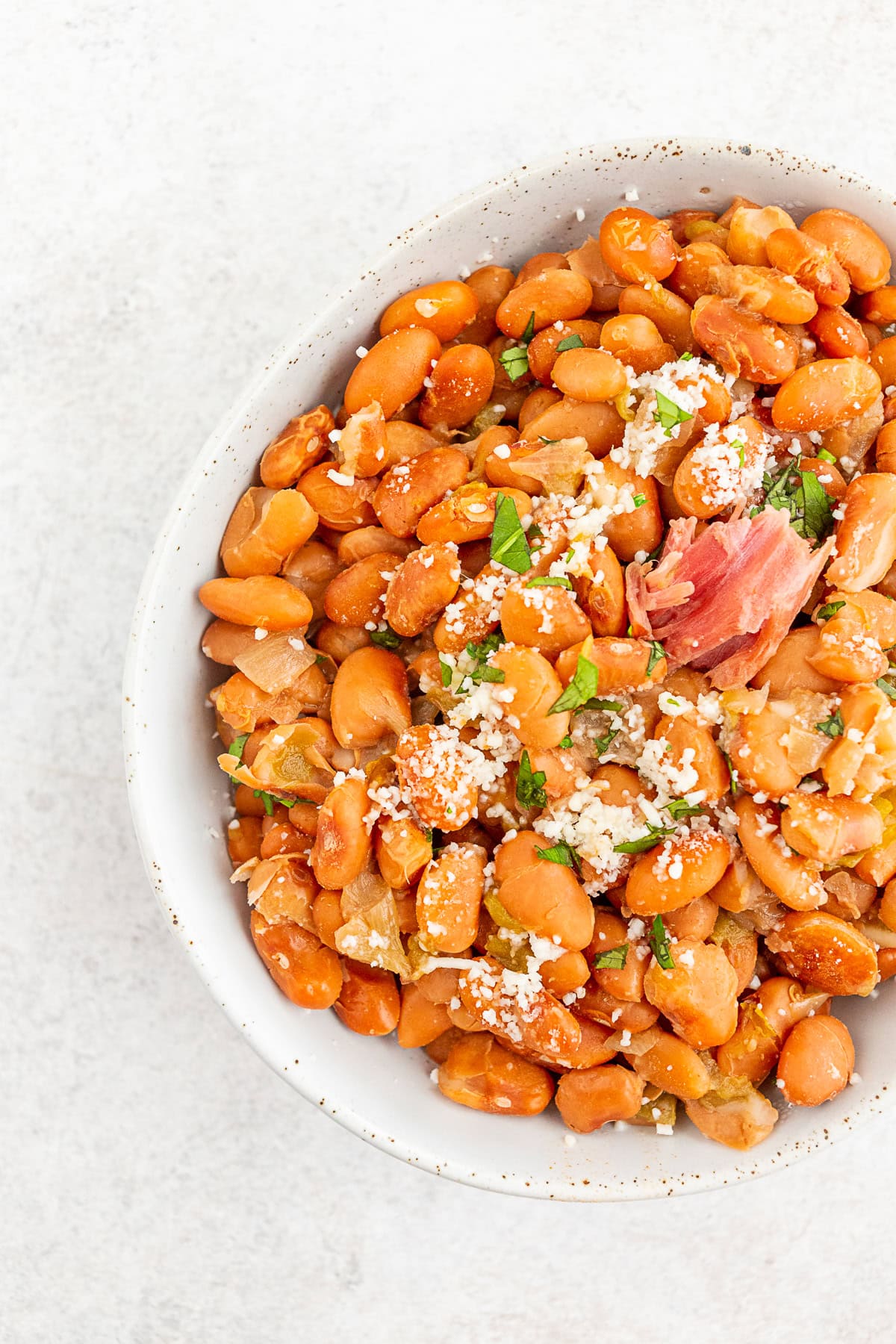 Instant Pot pinto beans in a white ceramic bowl