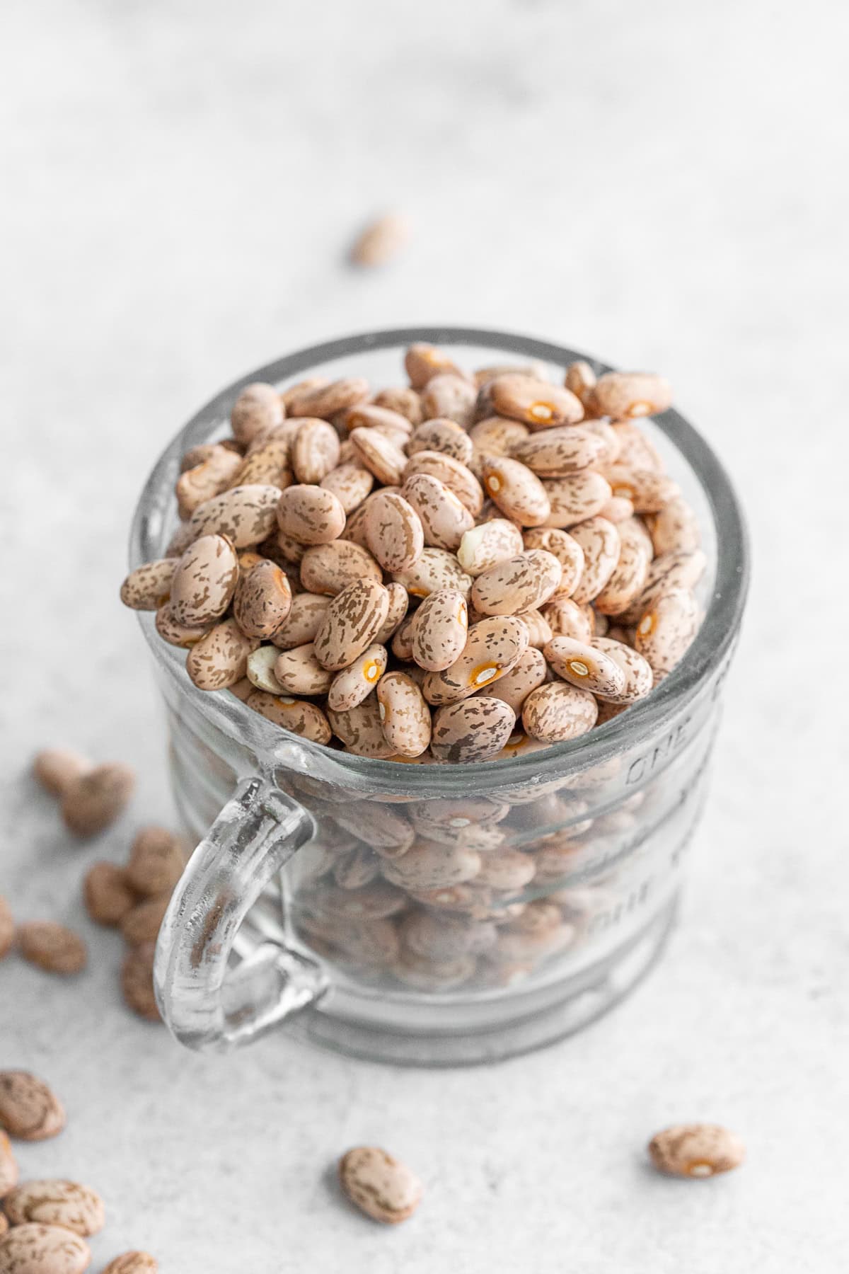 Dried pinto beans in a cup