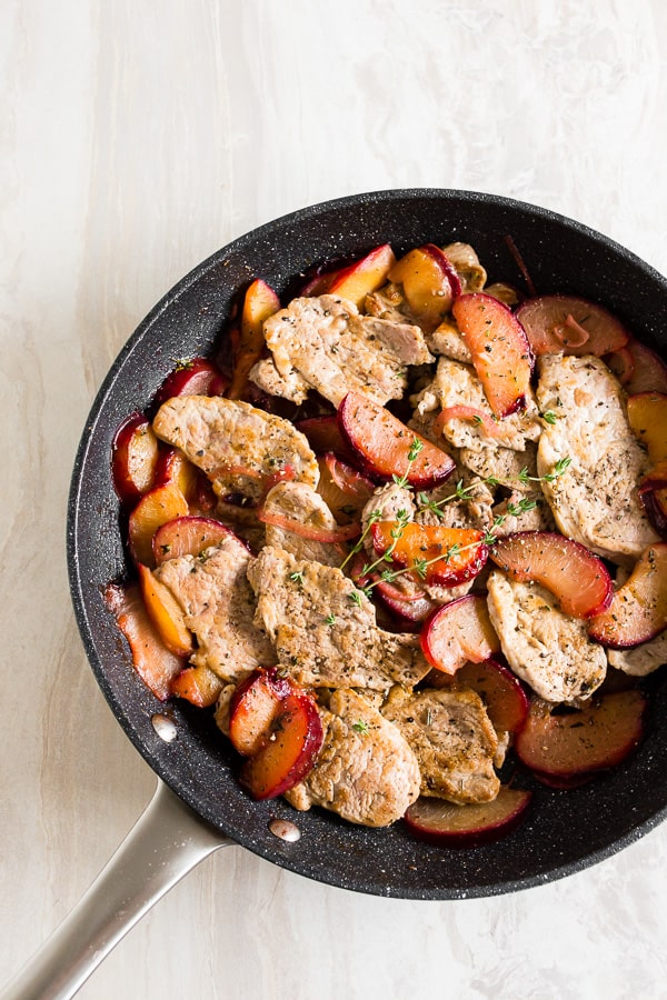 overhead shot of skillet pork tenderloin with plums