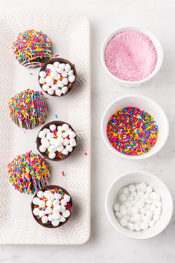 half made chocolate strawberry funfetti hot chocolate bombs