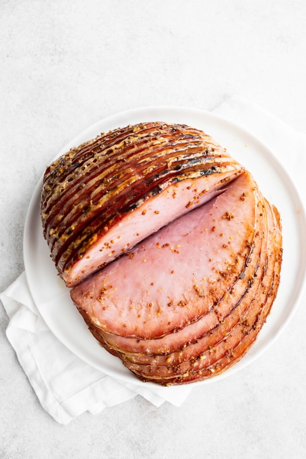 Honey mustard spiral ham cut open to show ham slices.
