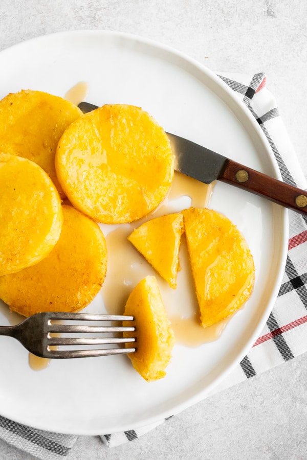 sliced fried cornmeal mush with maple syrup. 