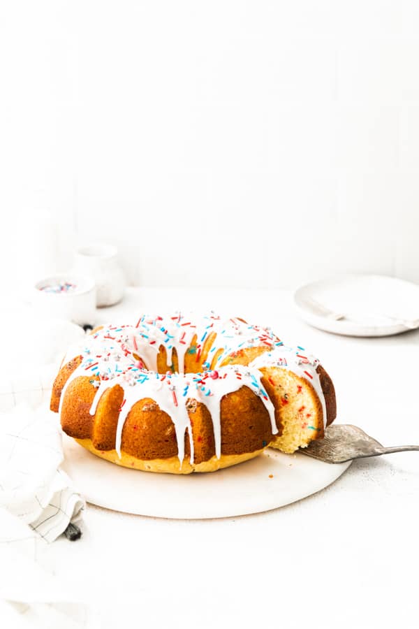 Cutting a Fourth of July Bundt Cake.