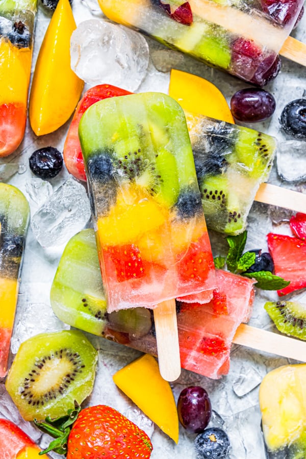 close up of rainbow fruit popsicle.