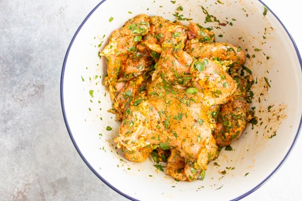 Chicken thighs marinating in a cilantro lime marinade.