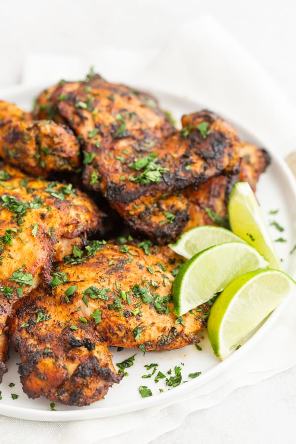 Grilled Cilantro Lime Chicken Thighs served with extra lime slices.