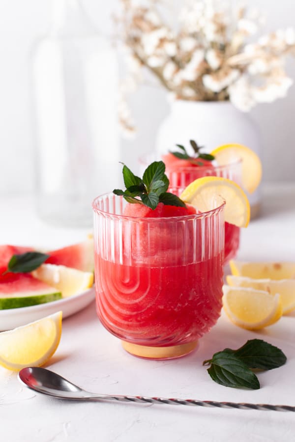 Watermelon Frose in a delicate glass served with fresh mint garnish. 