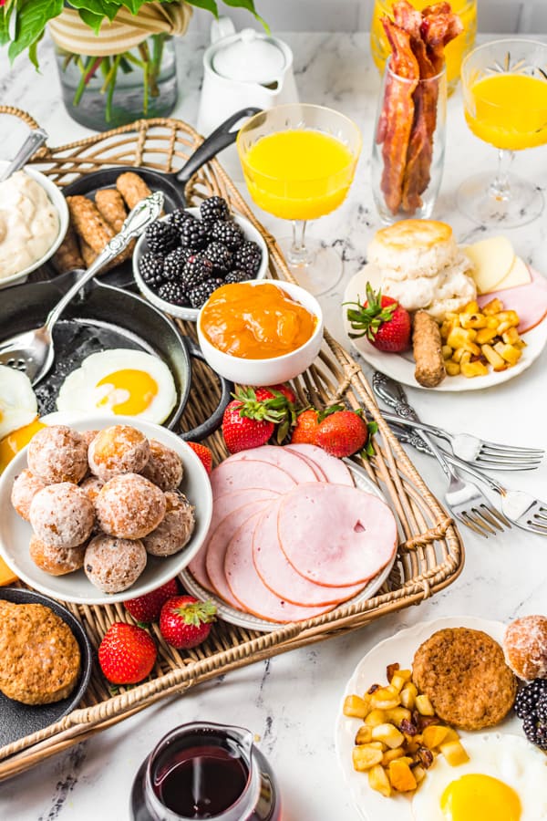 Breakfast Charcuterie Board sitting on a wicker serving stray. 