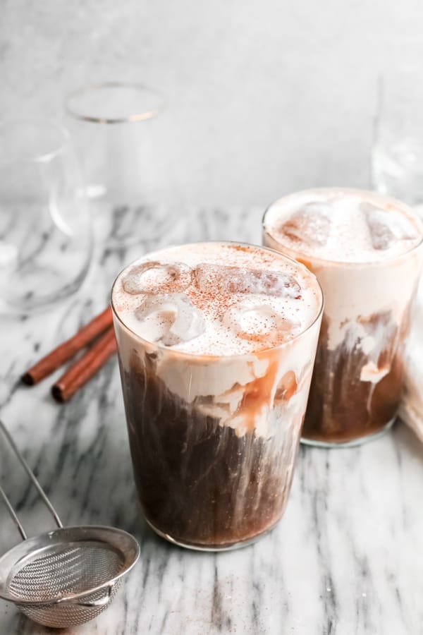 Pumpkin Cream Cold Brew Coffee in a glass topped with pumpkin pie spice.